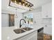 Spacious kitchen with a view of the outside, stainless steel appliances, and an island sink at 424 Fulton Dr, Kings Mountain, NC 28086