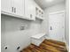 Functional laundry room with built in cabinets, a bench, and hard surface floors at 424 Fulton Dr, Kings Mountain, NC 28086