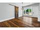 Bright, modern living room with wood floors, large windows, and a rustic sliding barn door at 424 Fulton Dr, Kings Mountain, NC 28086