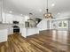 Spacious living area with open kitchen, dining area, and staircase, showcasing modern design at 424 Fulton Dr, Kings Mountain, NC 28086