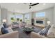 Stylish living room with fireplace, ceiling fan, and tastefully arranged furniture at 424 Fulton Dr, Kings Mountain, NC 28086