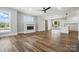 Open living space showcasing wood floors, a fireplace, large windows, and a sliding barn door at 424 Fulton Dr, Kings Mountain, NC 28086