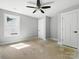 Bare room with overhead ceiling fan and visible sub-straight ready for new flooring at 424 Fulton Dr, Kings Mountain, NC 28086