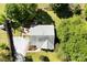 Overhead view of home with a large yard and a deck for outdoor enjoyment, surrounded by mature trees at 459 Cramerton Rd, Gastonia, NC 28056