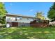 Large backyard featuring a deck, walkout basement, and expansive green lawn at 459 Cramerton Rd, Gastonia, NC 28056