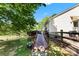 Spacious backyard with a ramp leading to a deck and fenced area with grazing sheep at 459 Cramerton Rd, Gastonia, NC 28056