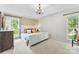 Bright bedroom featuring windows, and neutral colored carpet at 459 Cramerton Rd, Gastonia, NC 28056