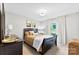 Cozy bedroom featuring a window view and neutral decor with natural lighting at 459 Cramerton Rd, Gastonia, NC 28056