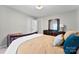 Comfortable bedroom featuring a dresser with large mirror and neutral decor at 459 Cramerton Rd, Gastonia, NC 28056