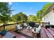 Relaxing deck area with comfortable seating, a grill, and views of the yard at 459 Cramerton Rd, Gastonia, NC 28056
