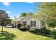 Charming single-story home with manicured lawn, mature trees, and inviting curb appeal on a sunny day at 459 Cramerton Rd, Gastonia, NC 28056