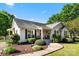 Inviting home with a well-kept lawn, charming front porch, and bright orange front door at 459 Cramerton Rd, Gastonia, NC 28056