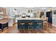 Bright kitchen boasts white cabinets, stainless steel appliances, and a large island with seating at 459 Cramerton Rd, Gastonia, NC 28056