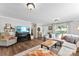 Comfortable living room with hardwood floors, a sectional sofa, and ample natural light at 459 Cramerton Rd, Gastonia, NC 28056