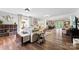 Spacious and open living room with hardwood floors, neutral decor, and a view into dining area at 459 Cramerton Rd, Gastonia, NC 28056