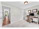 Cozy office space with desk, neutral carpet, and view to the hallway at 459 Cramerton Rd, Gastonia, NC 28056