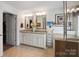 Bright bathroom with double vanity, granite counters, and neutral tile flooring, offers a spacious layout at 4607 Bonroi Ave, Charlotte, NC 28213