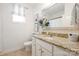 Bright bathroom features granite countertop, white cabinets and neutral tile flooring at 4607 Bonroi Ave, Charlotte, NC 28213