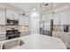 Contemporary kitchen features granite countertops, stainless steel appliances, and gray cabinets for a modern design at 4607 Bonroi Ave, Charlotte, NC 28213
