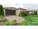 This backyard features a stone patio, a screened-in porch, and professional landscaping at 4991 Looking Glass Trl, Denver, NC 28037