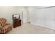 Bedroom with neutral walls, chair and closet provide ample storage space for comfortable living at 4991 Looking Glass Trl, Denver, NC 28037
