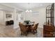 Cozy dining room with modern lighting fixture, adjacent to office space at 4991 Looking Glass Trl, Denver, NC 28037