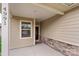 Inviting front porch with stone accents and neutral siding for great curb appeal at 4991 Looking Glass Trl, Denver, NC 28037