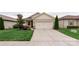 Charming home featuring a two-car garage, well-manicured lawn, and beautiful landscaping at 4991 Looking Glass Trl, Denver, NC 28037