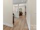 Light and bright hallway leading to dining and living spaces with beautiful flooring at 4991 Looking Glass Trl, Denver, NC 28037