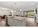 Open concept kitchen with granite countertops, a large island, and stainless steel appliances at 4991 Looking Glass Trl, Denver, NC 28037