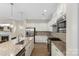 Modern kitchen featuring granite countertops, stainless steel appliances, and ample cabinet space at 4991 Looking Glass Trl, Denver, NC 28037
