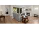 Cozy living room with hardwood floors, a fireplace, and sliding doors to the backyard at 4991 Looking Glass Trl, Denver, NC 28037