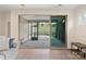 A view from inside the home of the sliding doors to a screened patio with backyard at 4991 Looking Glass Trl, Denver, NC 28037