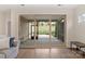 A large sliding door opens to a screened patio with views of the backyard at 4991 Looking Glass Trl, Denver, NC 28037