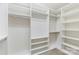 Bright walk-in closet boasts custom shelving and ample storage space, ready for organization at 4991 Looking Glass Trl, Denver, NC 28037