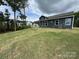 New home has a large lawn leading to a covered porch at 5006 Mclaughlin Dr # 103, Waxhaw, NC 28173