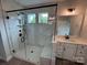 Bathroom with glass shower with white subway tile and matte black fixtures, vanity with quartz counters at 5006 Mclaughlin Dr # 103, Waxhaw, NC 28173
