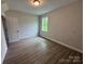 Bedroom with wood-look floors and neutral colored walls at 5006 Mclaughlin Dr # 103, Waxhaw, NC 28173