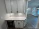 Butler's pantry with white cabinets, quartz countertop, wine cooler, and open access to foyer at 5006 Mclaughlin Dr # 103, Waxhaw, NC 28173