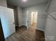 Walk-in closet with hardwood floors, wire shelving and a door leading into another room at 5006 Mclaughlin Dr # 103, Waxhaw, NC 28173