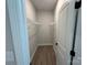 Empty closet with metal shelving and wood-look floors at 5006 Mclaughlin Dr # 103, Waxhaw, NC 28173