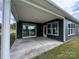 Spacious covered porch with gray siding and a view of the backyard at 5006 Mclaughlin Dr # 103, Waxhaw, NC 28173