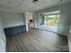 Dining room with wood floors, custom cabinets, and sliding glass doors to the backyard at 5006 Mclaughlin Dr # 103, Waxhaw, NC 28173