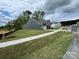 Long shot showing a new gray home in an undeveloped neighborhood at 5006 Mclaughlin Dr # 103, Waxhaw, NC 28173