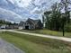 Gray home with a sidewalk along the lawn, in an undeveloped neighborhood at 5006 Mclaughlin Dr # 103, Waxhaw, NC 28173
