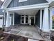 Covered front porch with a stone foundation, and white columns at 5006 Mclaughlin Dr # 103, Waxhaw, NC 28173