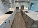 Spacious kitchen island with quartz countertops and stainless-steel appliances at 5006 Mclaughlin Dr # 103, Waxhaw, NC 28173
