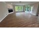 Bright living room with large windows, fireplace, and wood floors at 5006 Mclaughlin Dr # 103, Waxhaw, NC 28173