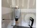 Close up of a Rinnai tankless water heater mounted on the wall at 5006 Mclaughlin Dr # 103, Waxhaw, NC 28173