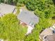 Overhead view of a home with a well-maintained roof and surrounding green trees at 511 Pembroke Ln, Waxhaw, NC 28173